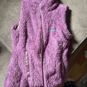 Reversible vintage Patagonia purple vest. Worn- tag is faded-Size Small
